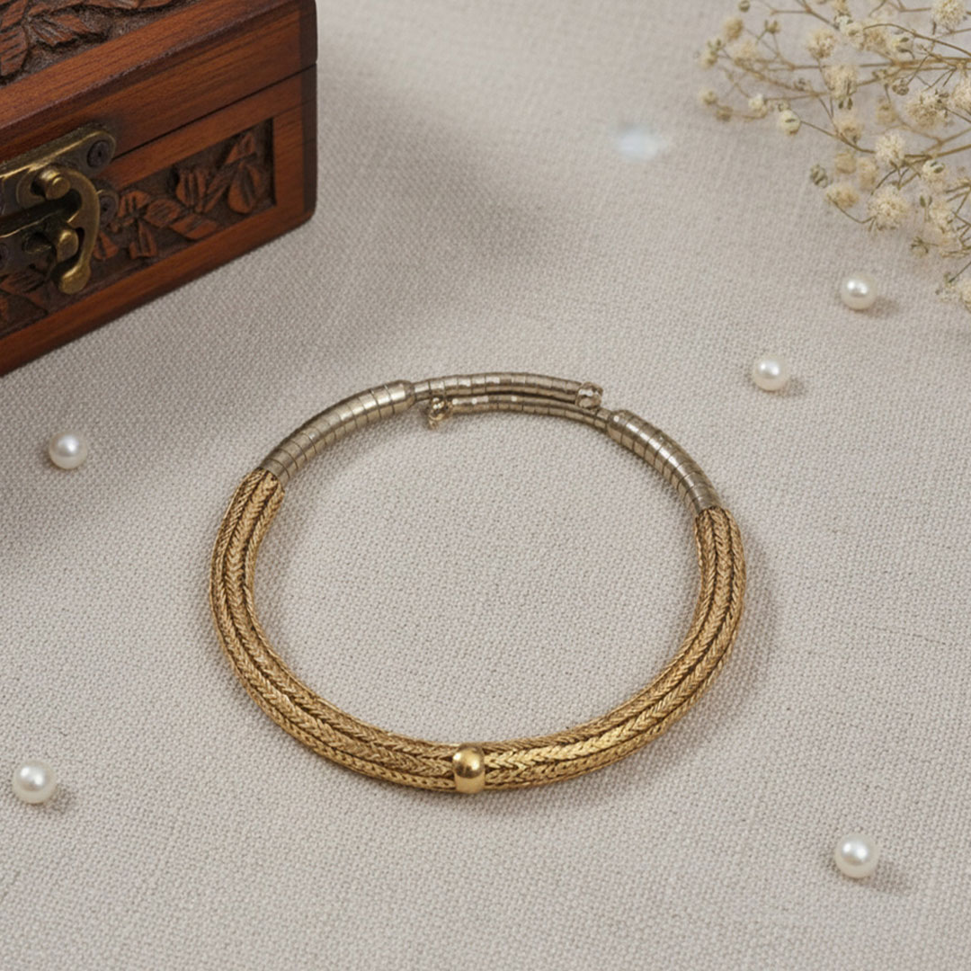 Gold-Plated Metal Bangle with Braided and Smooth Design