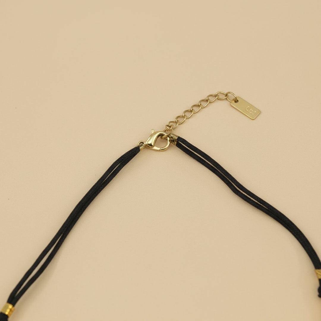 Gold-Tone Metal Necklace on Black Cord Golden Crest Necklace - Image 4
